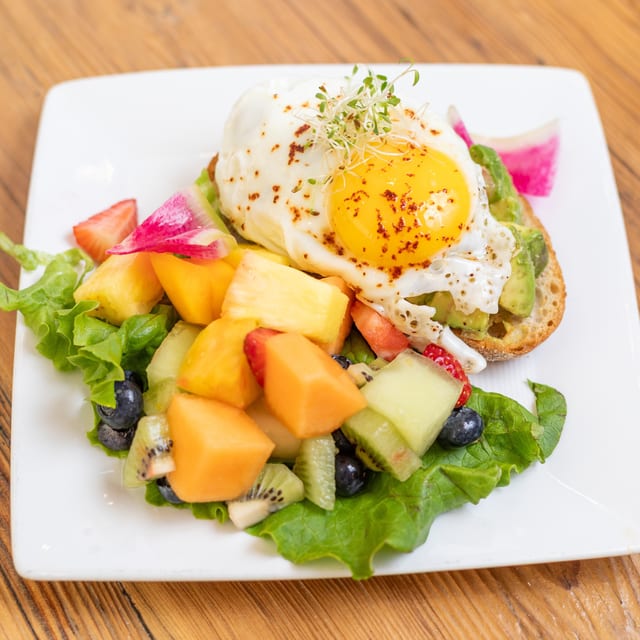 Avocado Toast w/ Egg Any-Style & Fruit.